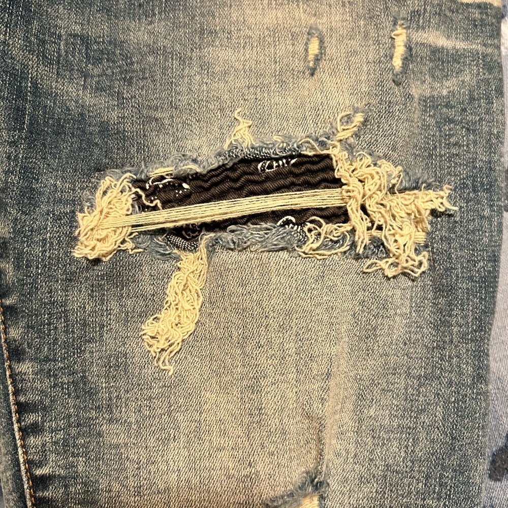 Distressed Blue Denim Jeans